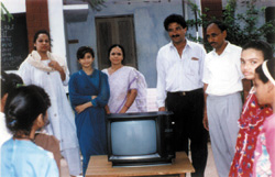 Trustees presented TV to children in same school.